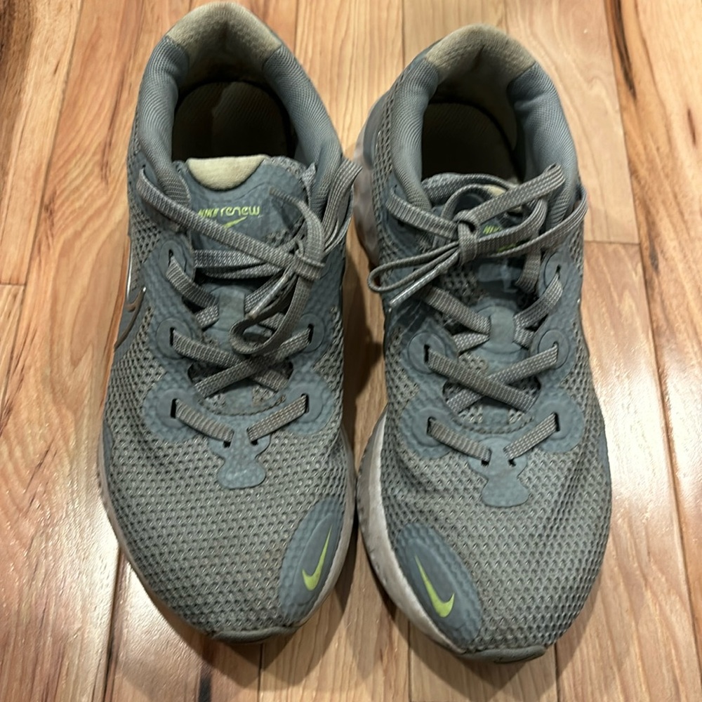 Women’s size 7 Nike renew sneakers. Very loved and comfortable.